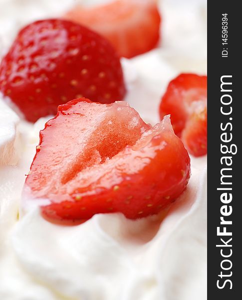 Fresh strawberries on cream high resolution image