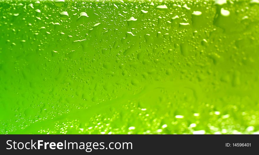 Wet beer bottle macro abstract