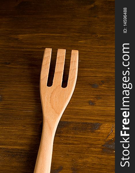 Pohoto of kitchen untensils made of wood on a wood table