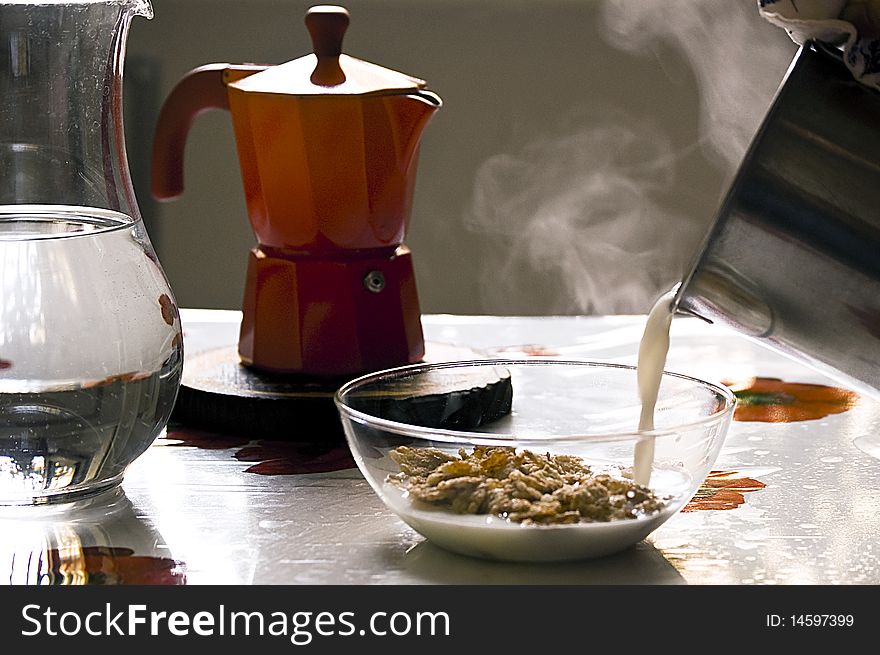 Coffe, hot milk and cornflakes for a tasty breakfast. Coffe, hot milk and cornflakes for a tasty breakfast