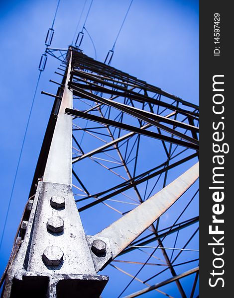 Electric pylon silhouette and dark blue stormy sky. Electric pylon silhouette and dark blue stormy sky