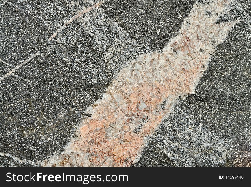 Granite texture. Small fragment of big stone