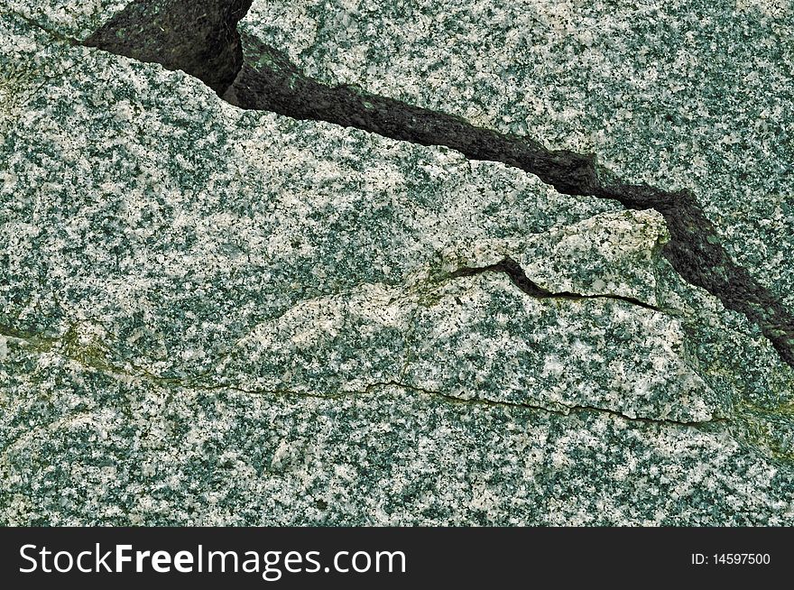 Crack. Granite texture. Small fragment of big stone