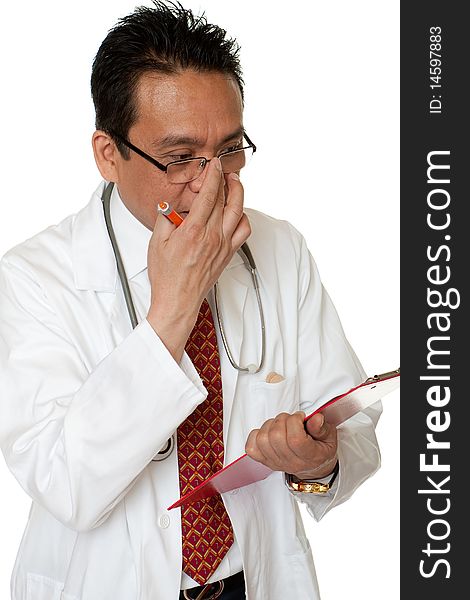 Friendly doctor while writing down diagnosis, studio admission before white background