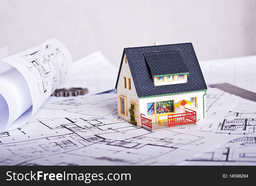 Miniature house on plans document