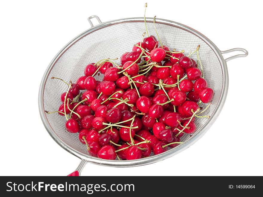 Cherry In Colander Over White