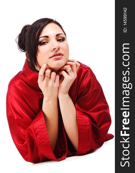 Picture of sensuality young woman in red gown on white background.