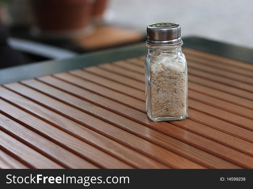 The salt shaker on wooden table, Odessa, Ukraine