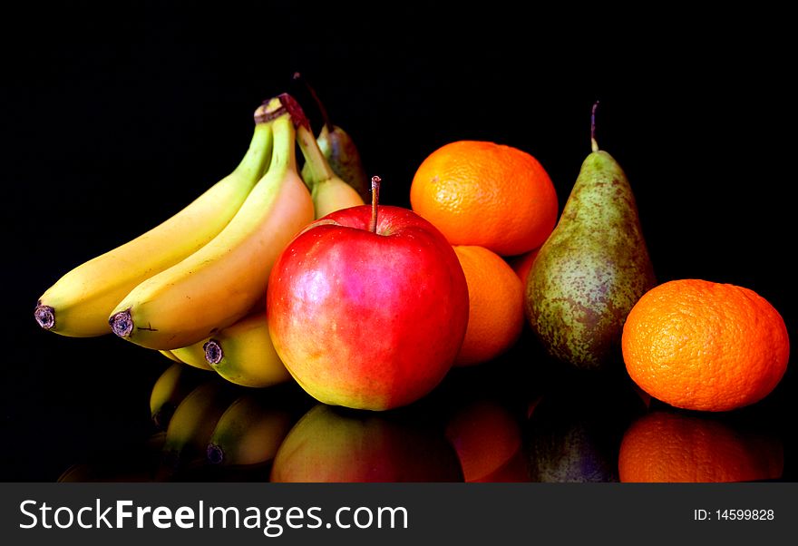 Fruits like banana, apple, orange and pear