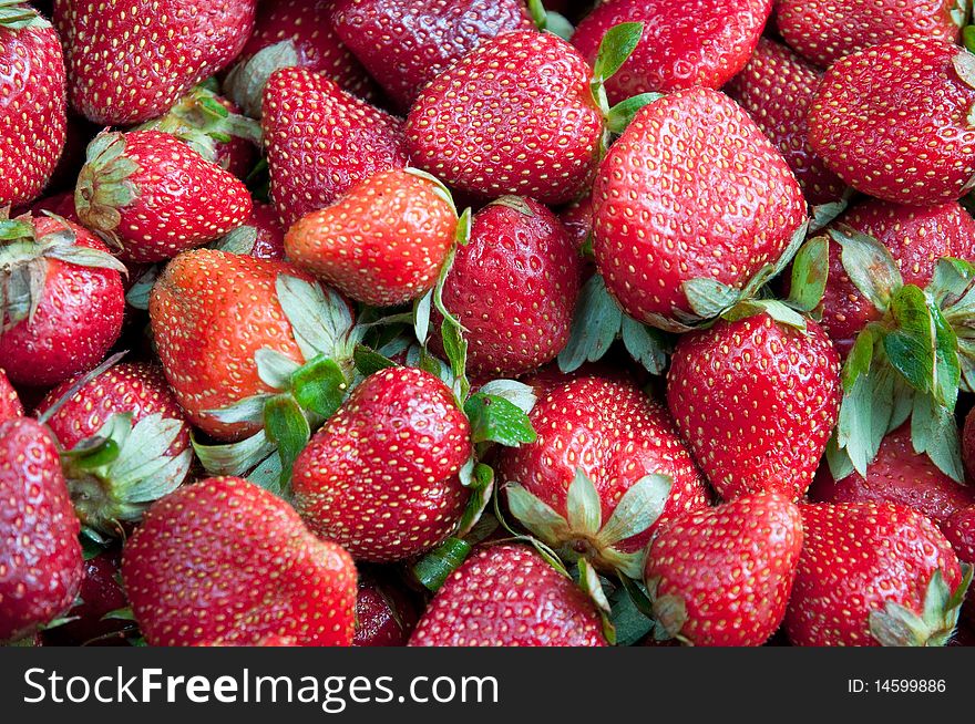 Red juicy strawberries abstract background closeup, horizontal. Red juicy strawberries abstract background closeup, horizontal