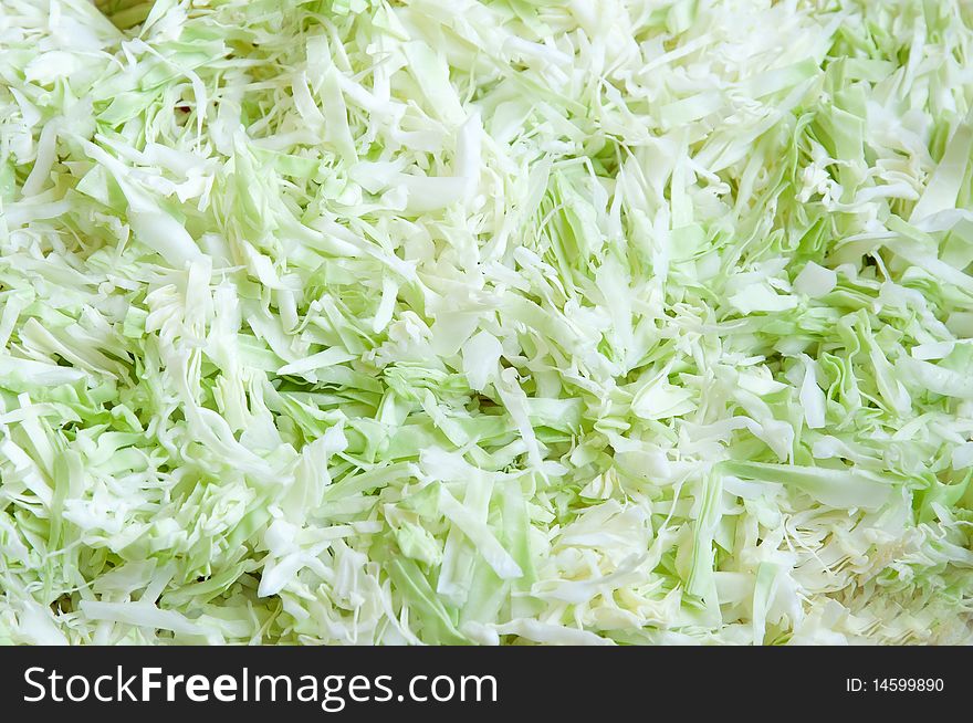 Sliced cabbage green abstract background, horizontal closeup. Sliced cabbage green abstract background, horizontal closeup