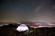 Tourist Camp On The Top Of Mountain Under Night Starry Sky Royalty Free Stock Photo