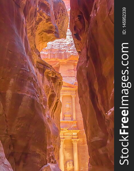 Breathtaking `Al-Khazneh` : the Treasury as it reveals in its full glory to the walkers in canyon `al-Siq`. Petra