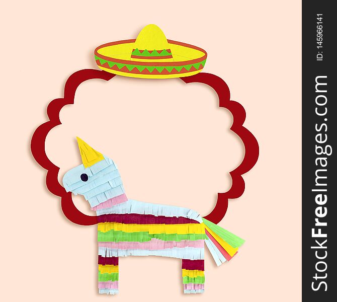 Frame with sombrero and pinata for Cinco de Mayo. Cinco de Mayo is federal holiday in Mexico on May 5th. Mexican symbols made of paper. Paper art and craft. Minimal holiday concept. Space for text