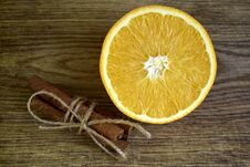 Ripe Orange, Cinnamon Sticks On Wooden Surface Stock Photo Ripe Orange, Cinnamon Sticks On Wooden Surface Stock Photo