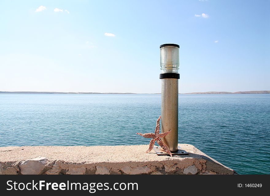 Harbour-detail with lamp and starfish. Harbour-detail with lamp and starfish