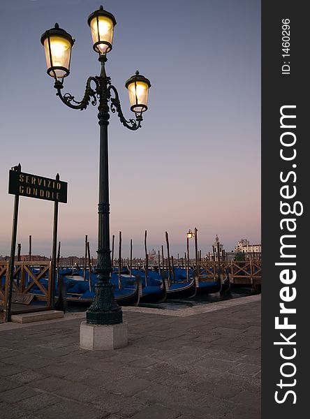 A row of Gondolas in Venice. A row of Gondolas in Venice