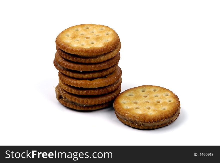 A stack of peanut wafers isolated against a white background. A stack of peanut wafers isolated against a white background.