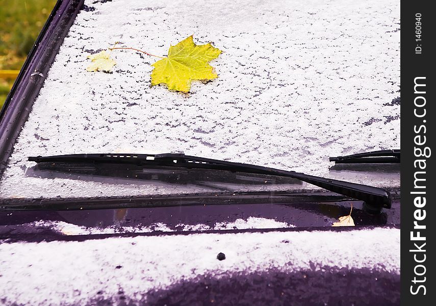 The late-autumn car covered by the first snow. The late-autumn car covered by the first snow