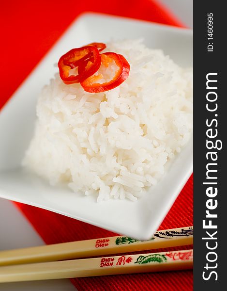 Healthy asian rice dish and chopsticks