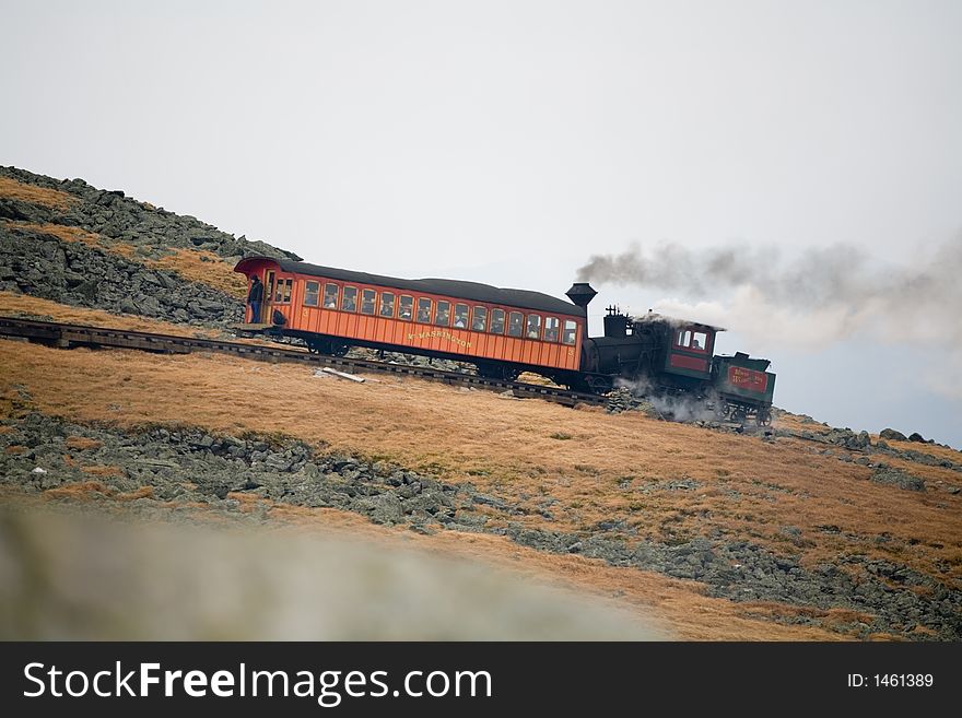 Tourist Train on Mt Washington in a Fall Cloudy Day