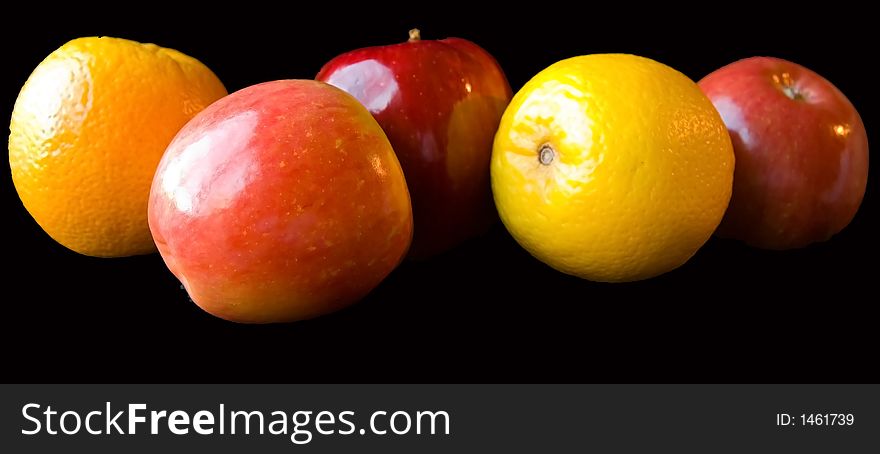 Apples and Oranges on a black background.