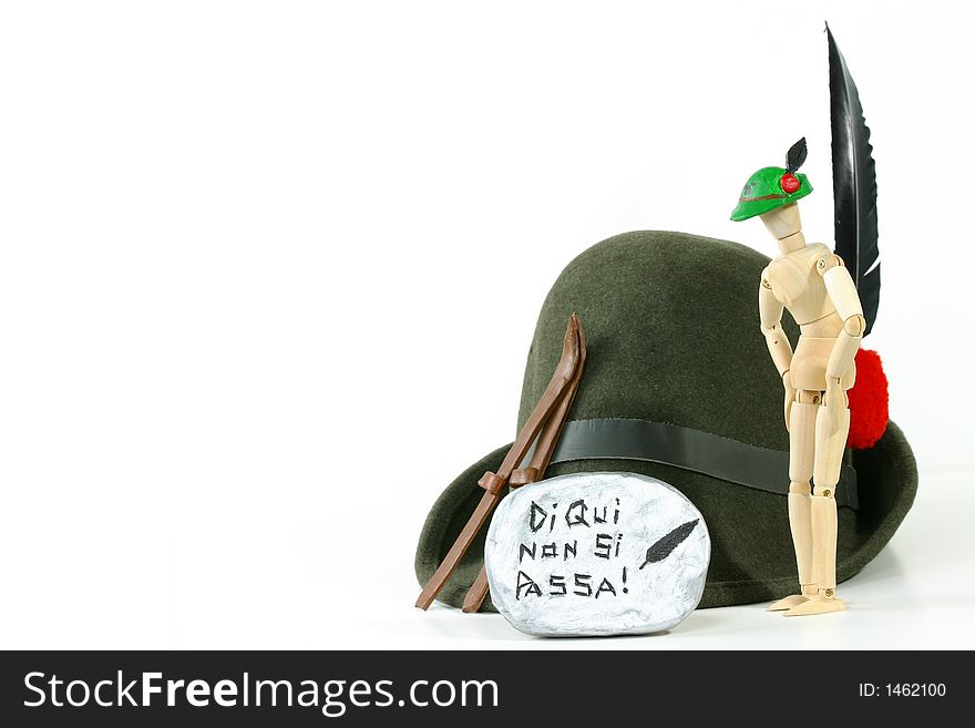 Alpini Hat (the sacred symbol of Italy's elite mountain troops) and skis on a rock. Alpini Hat (the sacred symbol of Italy's elite mountain troops) and skis on a rock.