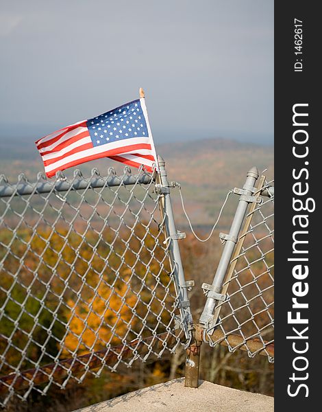 American Flag on Mountain Top and Foliage in New England