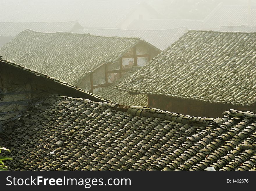 Tile roof in morning fog