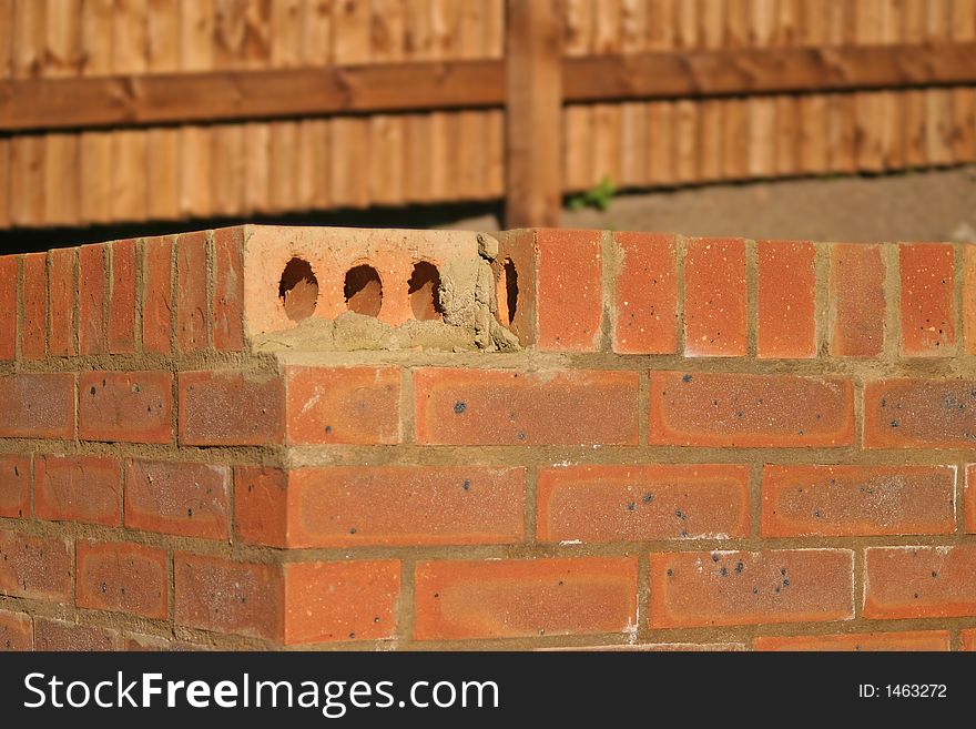 Missing brick on garden wall
