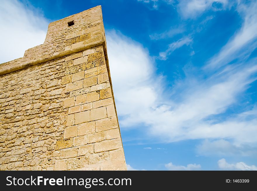 Ancient fortress over blue sky, vibrant colors, Mahdia, Tunisia