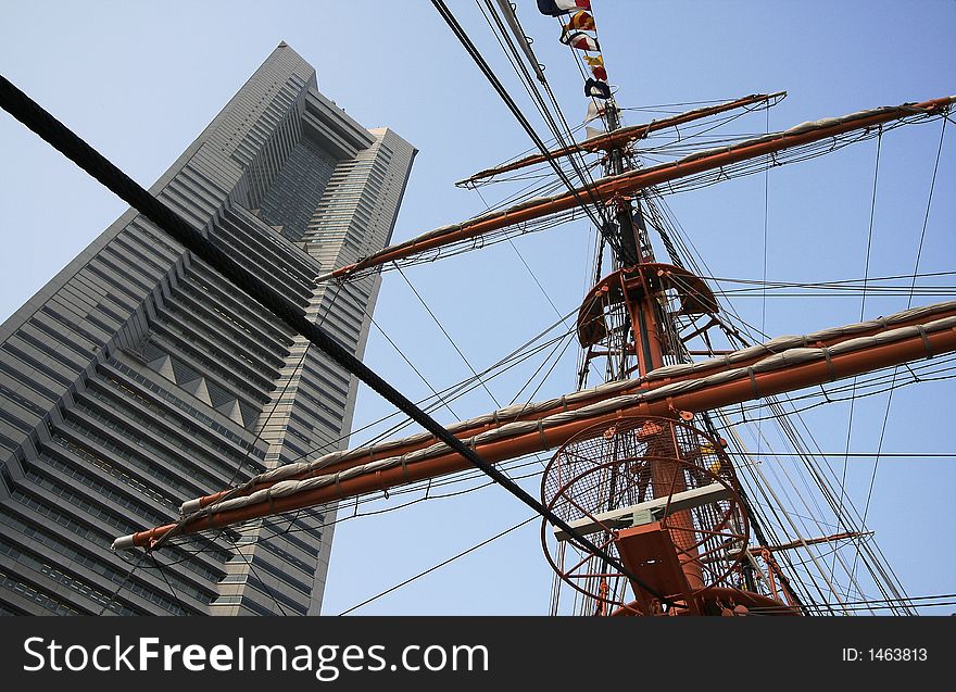 Modern building and sailboat masts. Japan. Yokohama.