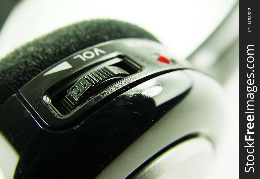 Cordless headphone controls including volume and on/off indicator. Cordless headphone controls including volume and on/off indicator.