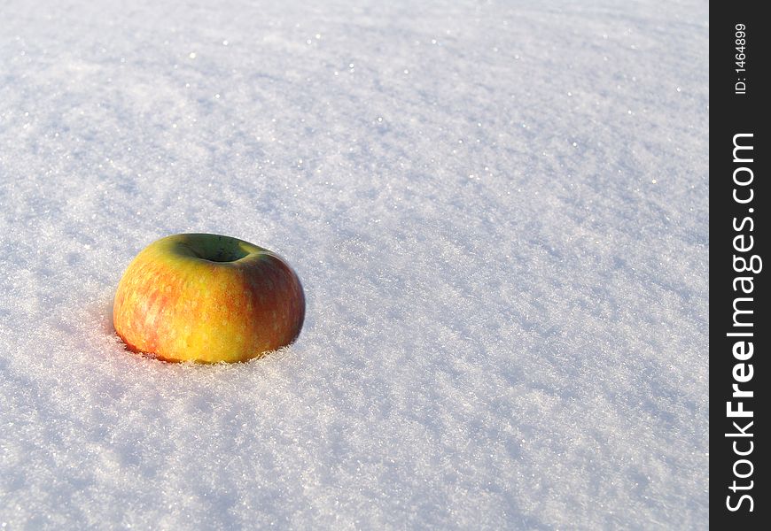 Juicy apple on the snow