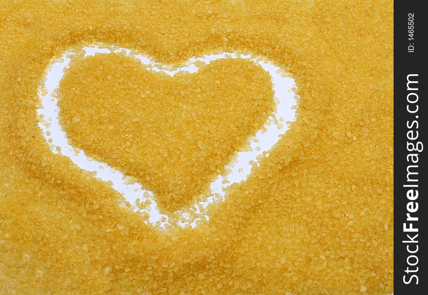 Heart drawed on bath salt on the white background