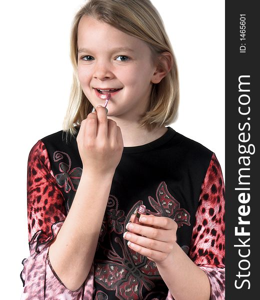 Isolated child putting on lipstick or lipgloss. Isolated child putting on lipstick or lipgloss