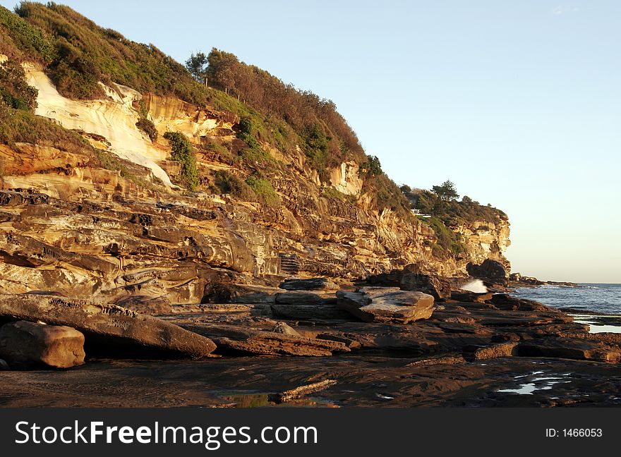 Steep Cliffs At The Sydney Coast In Golden Morning Light, Australia