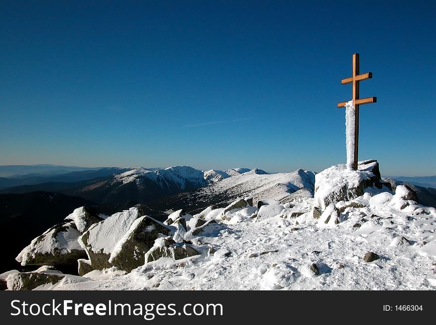 A double cross on the snow-covered top. A double cross on the snow-covered top