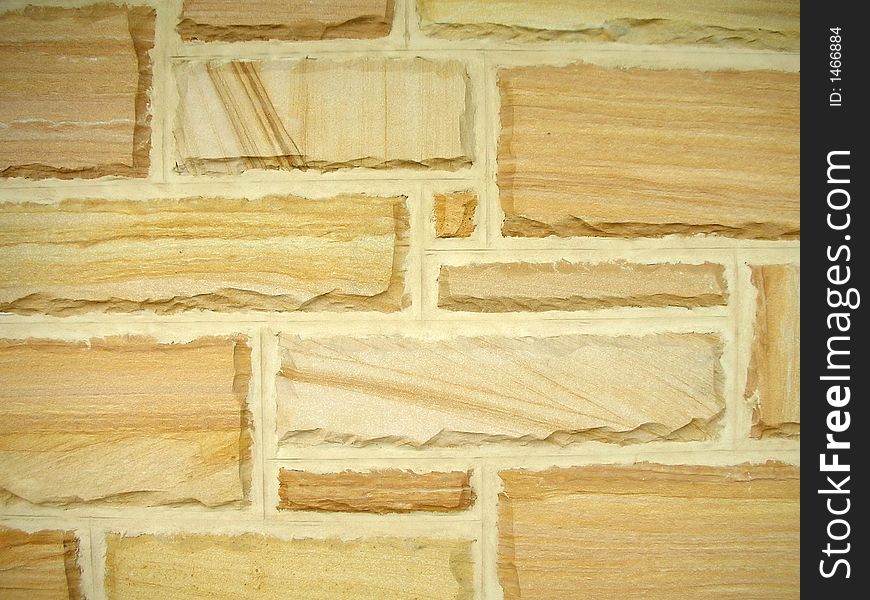 Wall background made from sandy colored stones. Wall background made from sandy colored stones
