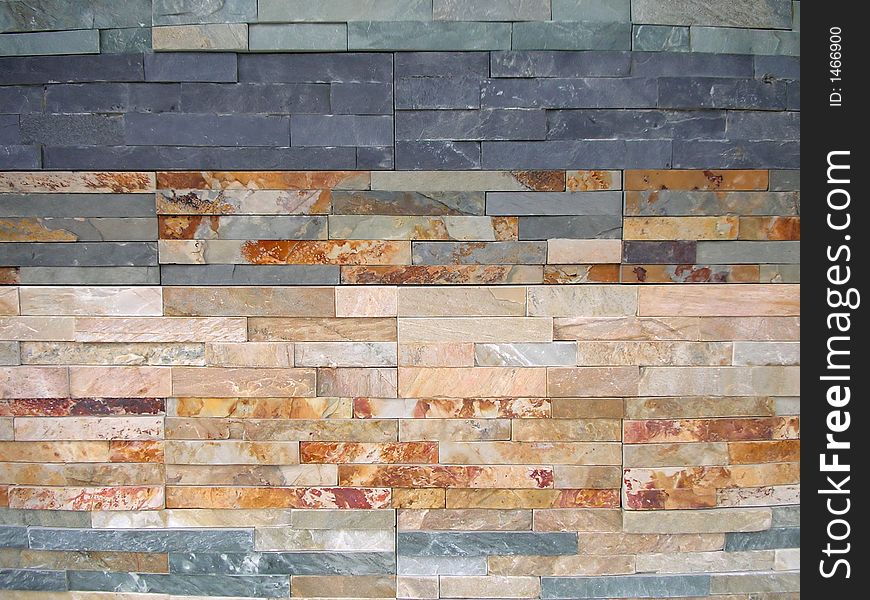 Wall background made from small colorful stone bricks. Wall background made from small colorful stone bricks