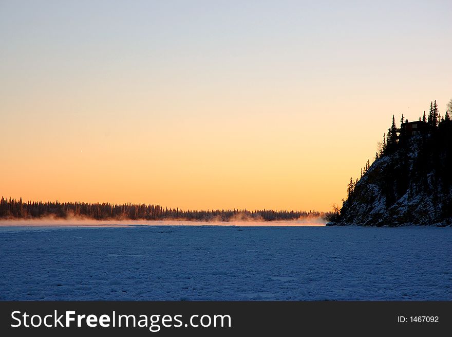 The sun sets on the frozen Chena River, near Fairbanks, Alaska. The sun sets on the frozen Chena River, near Fairbanks, Alaska.