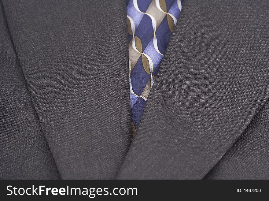 Up close of coat and tie to present a very business and fashion minded photograph. Up close of coat and tie to present a very business and fashion minded photograph.