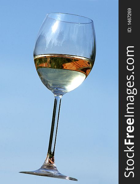Glass of wine with sky background. Glass of wine with sky background