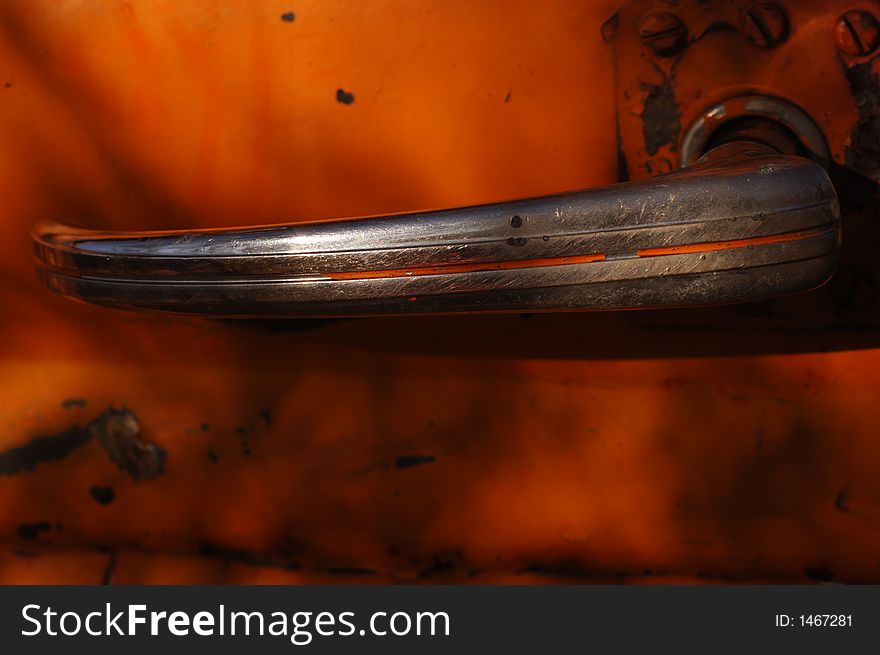 Vintage Rusted truck door handle in the desert