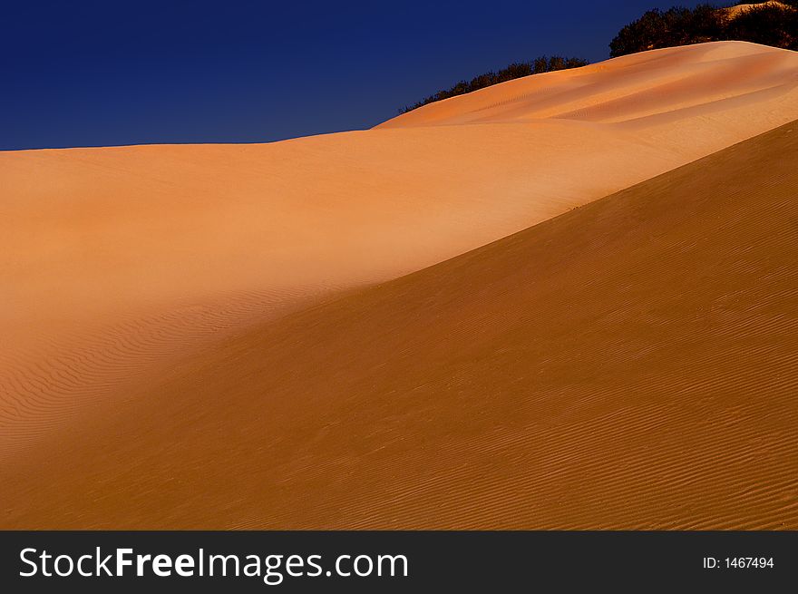 Beautiful lonely sand dunes with blue sky. Beautiful lonely sand dunes with blue sky