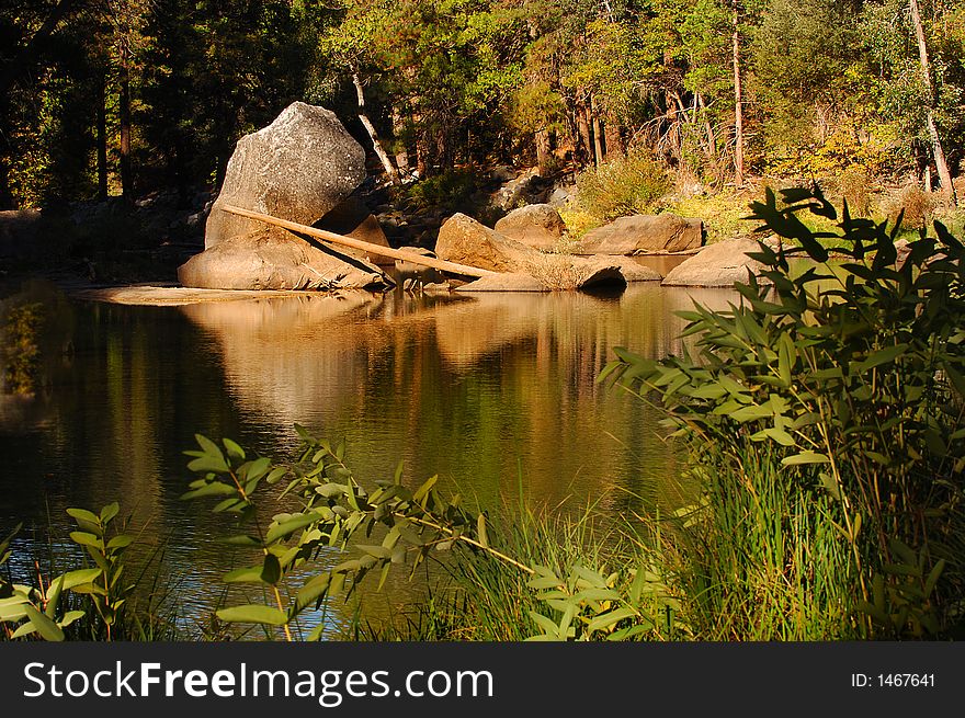 Beautiful flowing reflections in merced river. Beautiful flowing reflections in merced river