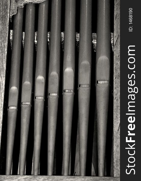 Close up of black and white organ pipes