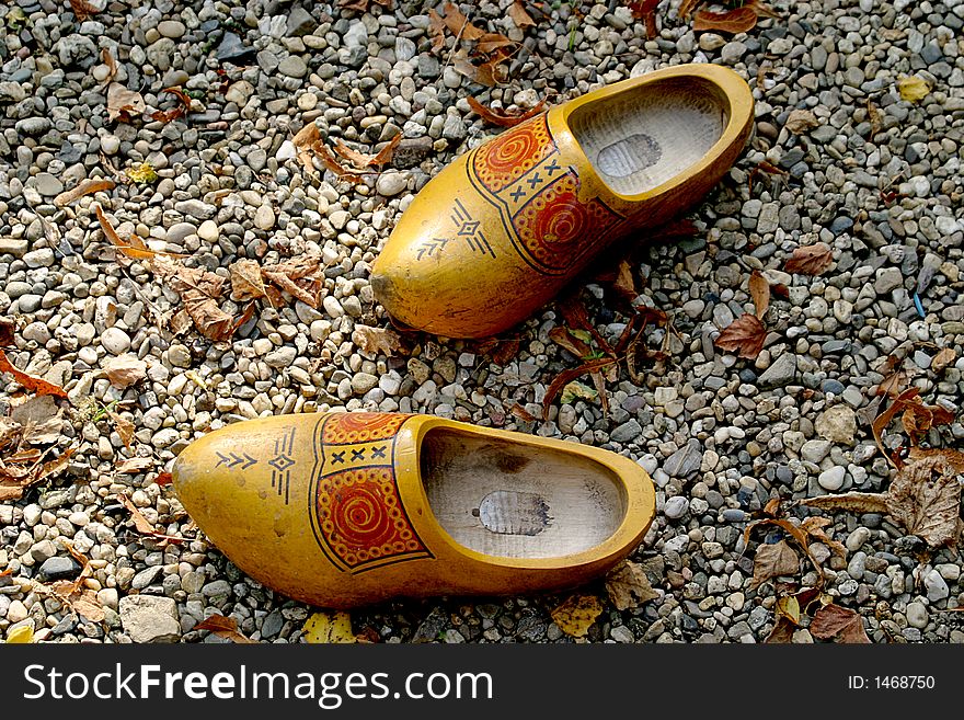 Wooden shoes in the gravel