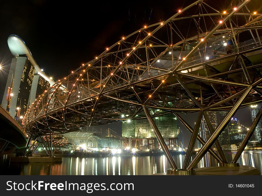 A steel bridge illuminates the night. A steel bridge illuminates the night.
