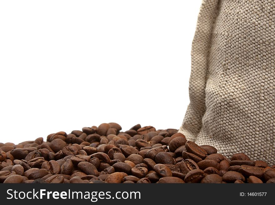 Coffee beans and burlap sack isolated on white